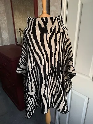 Uterque/Zara  - Zebra Patterned Poncho Style Coat. • £25