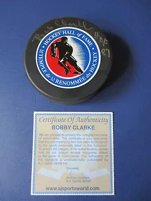 Bob Clarke HOF 87 Signed Autographed Hall Of Fame Logo Hockey Puck AJ Sports * • $39.99