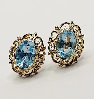 9ct Stud Oval Sky Blue Topaz Celtic Earrings 9ct Yellow Gold  • £95