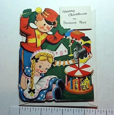 #B869- Unused Volland Xmas Greeting Card Die Cut Toy Soldier Train & Doll  • $24