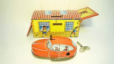 GREAT  VINTAGE  TIN  GARAGE  WITH  WIND  UP  CAR  MEHANOTEHNIKA  1960s • $329.90