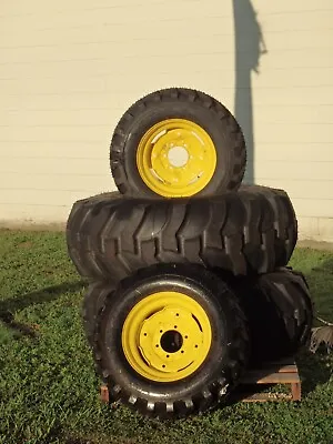  (2) 16.9-24 John Deere Rear Tractor Tires & (2) 10-16.5 Front Tires & Rims • $1200