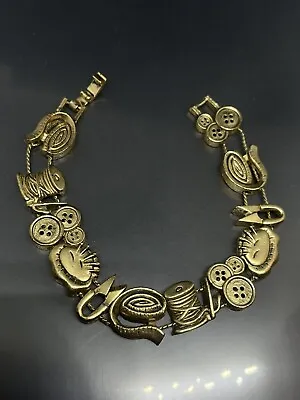 Vintage Unsigned Gold Tone 12 Charms Seamstress Sewing Theme 7.5” Slide Bracelet • $39