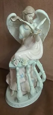 Mark O'Well Large Angel Opalescent Wings Leaning On Floral Trellis Holding Dove • $27.95