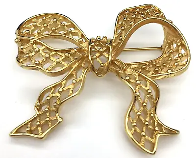 Vintage Monet Bow Brooch Gold Tone Open Diamond Pattern Signed • $10.95