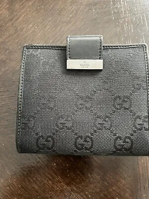Gucci Wallet -  GG Monogram Leather/Canvas Compact Wallet • $40