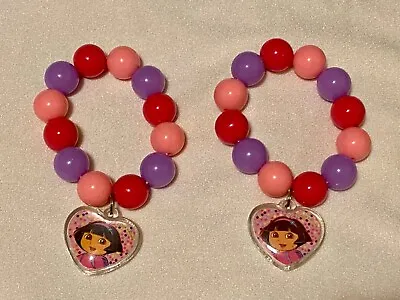 (2)Vtg Party BRACELET DORA EXPLORER-PinkPurple Beads Plastic-Elastic-Heart Charm • $9.95