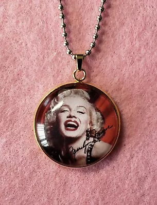 Marilyn Monroe Signature Laugh Glass Pendant. Stainless Steel 30mm.  • $12