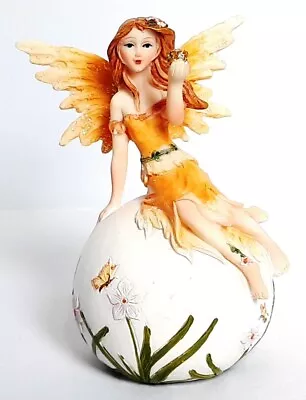 Fairy Pale Yellow Seated On A Decorated Ball And Holding A Gold Glitter Ball  • £6.25