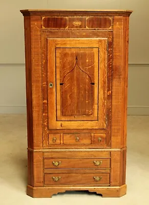A George III Oak And Mahogany Corner Cabinet. • $740.80
