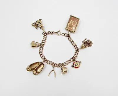 VINTAGE 9ct GOLD CHARM BRACELET WITH 8 CHARMS - CHURCH HAT BANKNOTE BALLET • £685