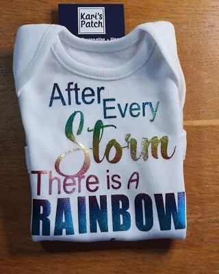 After Every Storm There Is A Rainbow Baby Bodysuit In Holographic Rainbow Design • £5.99