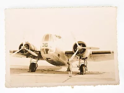 VINTAGE B&W SNAPSHOT C. 1940s DOUGLAS B-18A 36 WW2 MEDIUM BOMBER LADY IN FRONT • $29.99