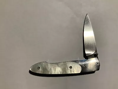 William Henry Pocketknife Titanium Frame And Mother Of Pearl Handles  {#4094} • $499.99