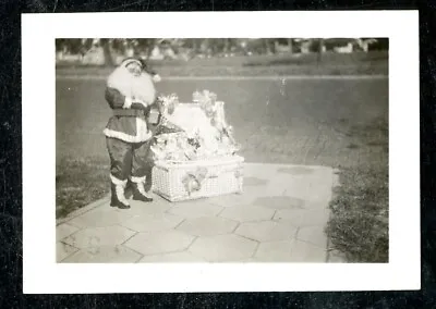 Vintage Christmas Photo SANTA WELCOMES GUESTS WITH WICKER BASKET FULL OF GIFTS • $3.46