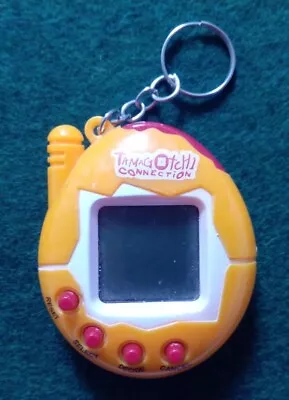 TAMOGOTCHI CONNECTION - Orange + White + Red • £2.99