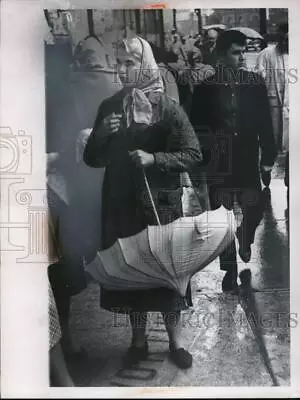 1960 Press Photo Woman With An Umbrella In The Rain In Cleveland Ohio • $19.99