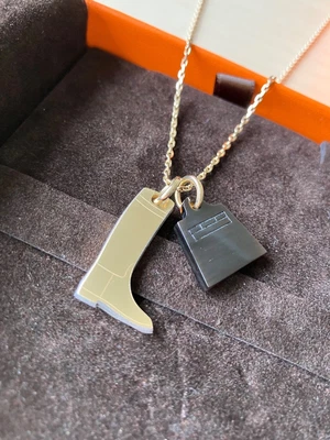 $190 • Buy Hermes Amulette Maroquinier Pendant Necklace Gold Metal Horn Small