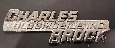 Charles Brock--Oldsmobile Inc.--Metal Dealer Emblem Car  Vintage SM6444 • $32.99