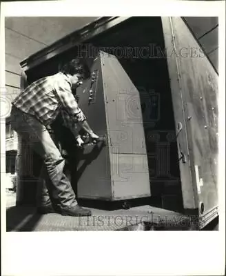 1988 Press Photo Calvin Miller Of C&G Trucking Rolls A Voting Machine • $19.99