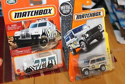 Matchbox-Land Rover-Lot Of 2-White '65 Gen II & Silver/Gray Land Rover 90 (2016) • $3.55
