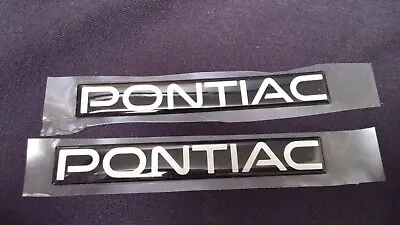 SET OF 2 - NOW OEM Pontiac Emblems Genuine GM - Black Silver • $22