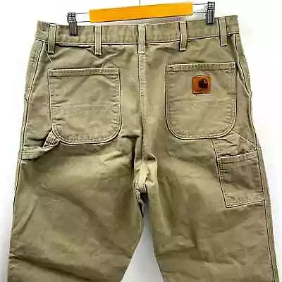 VINTAGE CARHARTT PANTS MENS SIZE 38x34 LOOSE FIT WASHED DUCK UTILITY WORK PANTS • $23.99