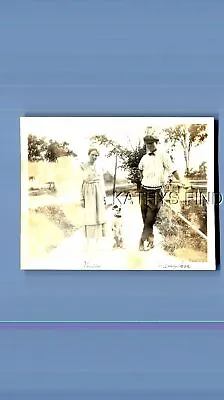 Found Vintage Photo G+9219 Man In Hat Posed By Pretty Woman In Dressdog • $6.98