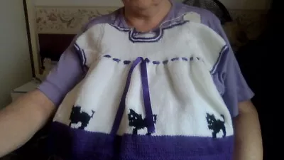 Hand Knitted Age 6-12 Months Purple And White Trimmed Dress With Cat Motiffs • £7