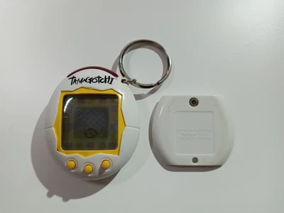 $74.98 • Buy FOR REPAIR - Tamagotchi 2004 White Shell Black Logo Yellow Border Yellow Buttons