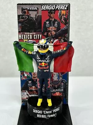 Figure 1/43 Sergio Pérez Oracle Red Bull Formula 1 With Flag + Podium • $64.31