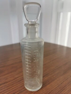 £4 • Buy VINTAGE(1913/1959)-CLEAR GLASS MEDICINE BOTTLE-TEASPOONS-WITH STOPPER-UGB-11x3cm