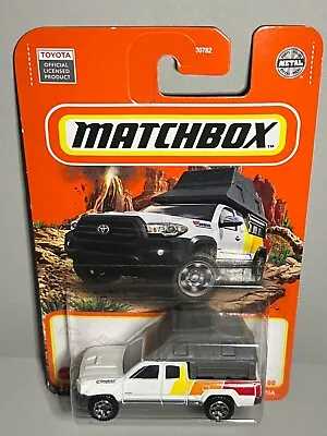 *Matchbox* [2016 Toyota Tacoma]  TRD White With Camper  (2022#100/100) • $3.75